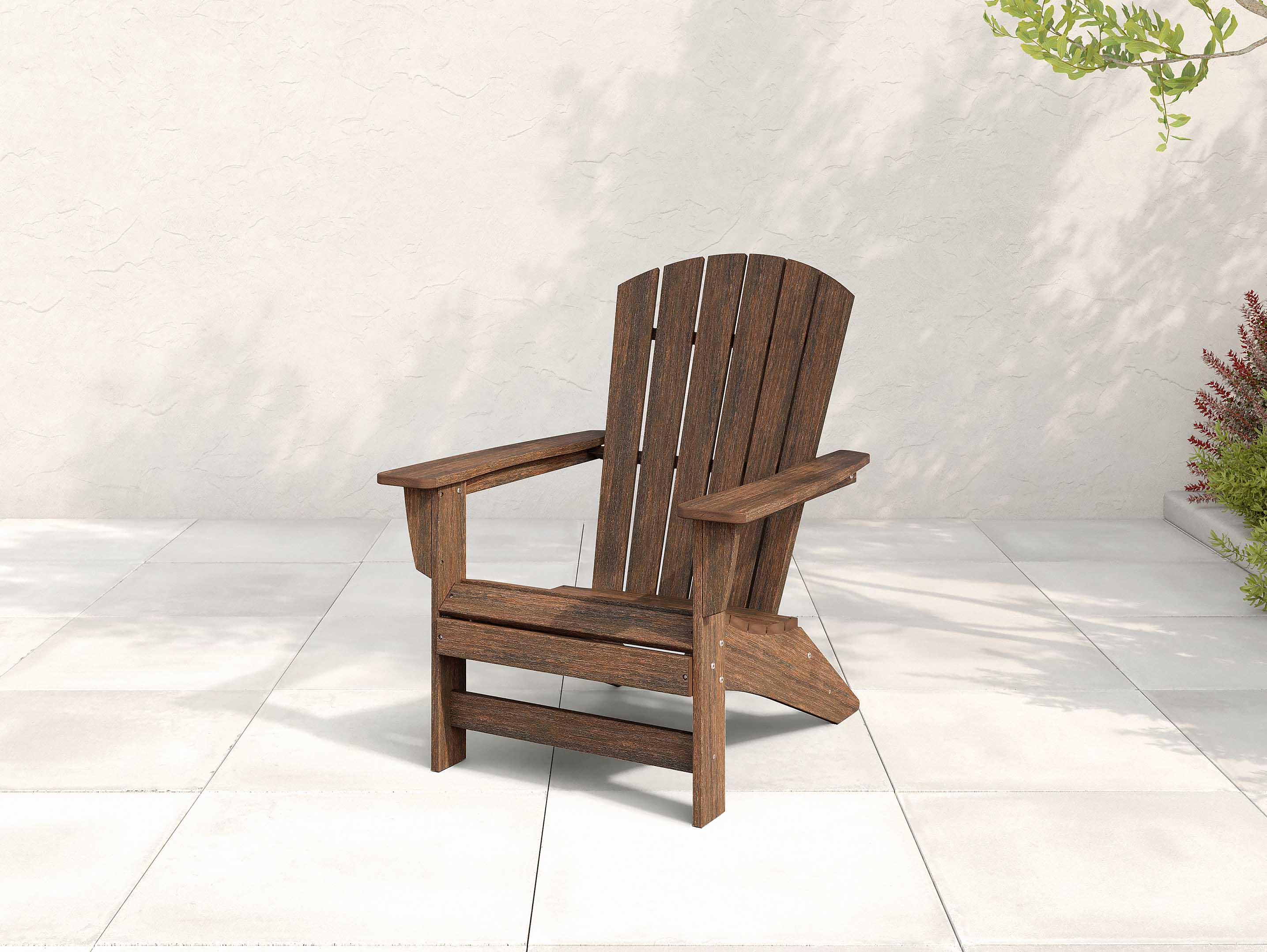 Brazilian walnut Johnson Bay Adirondack Chair on a shady patio