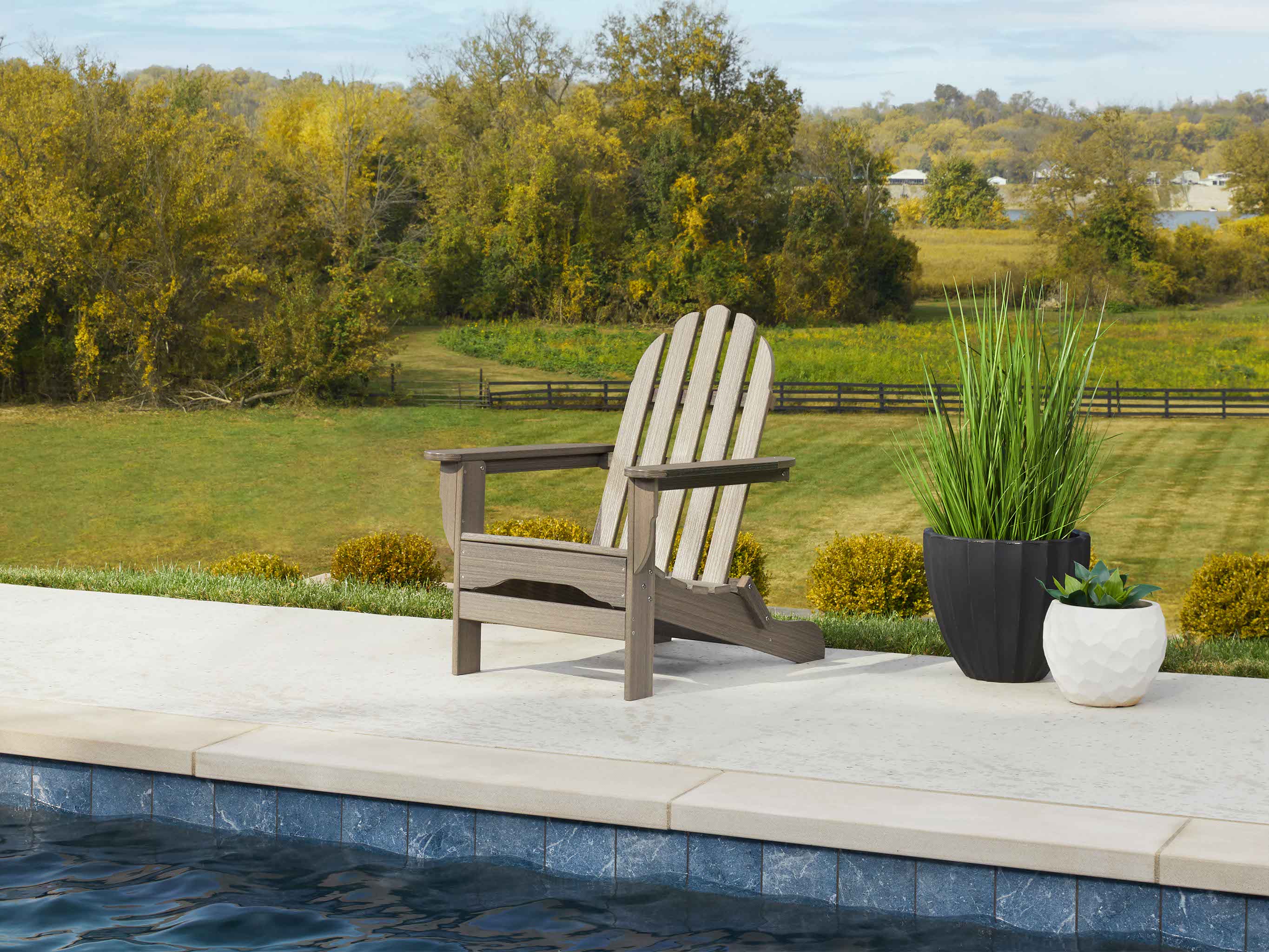 Coastal Gray Classic Adirondack Chair next to pool