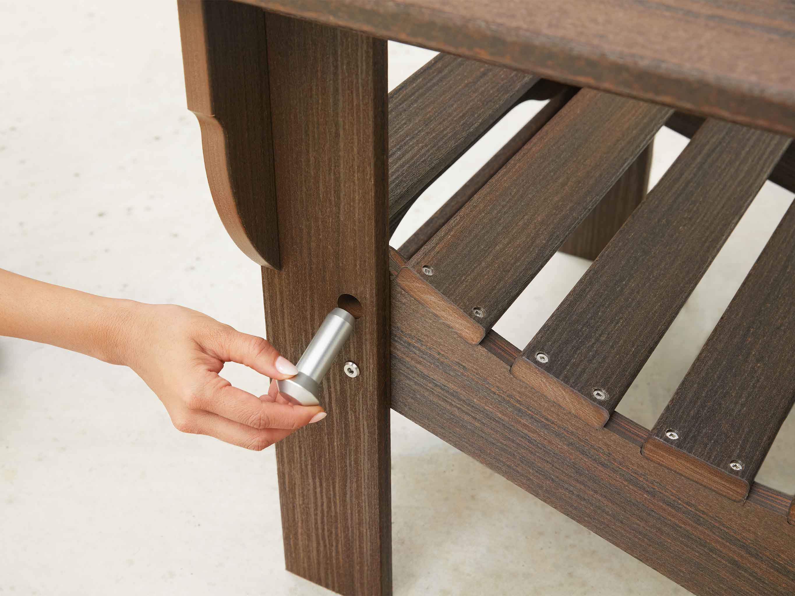 Folding Adirondack Chair Close Up of Pin being Inserted